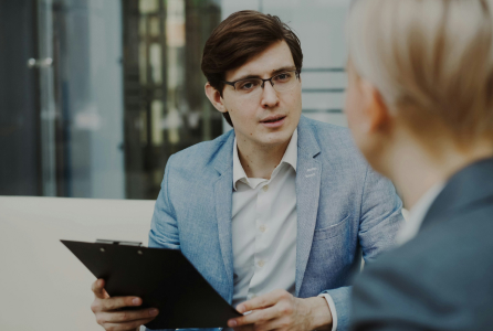 Two professionals reviewing financial documents in meeting