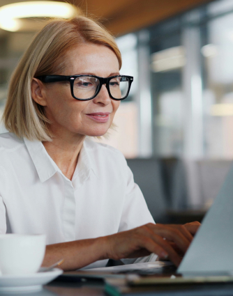Professional working on laptop in office setting