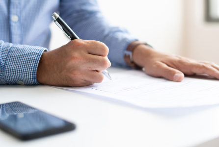 Professional signing financial planning documents