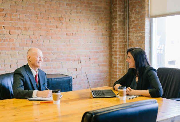 Two professionals meeting in office discussion