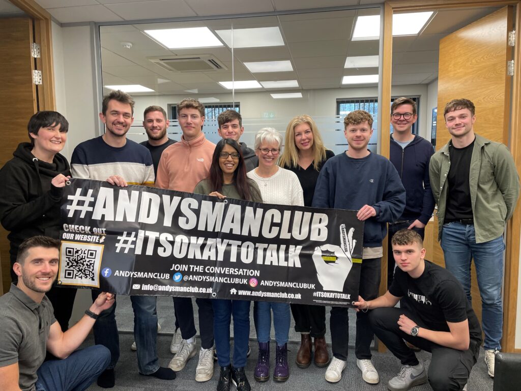Parsons Chartered Accountants to support ANDYSMANCLUB throughout 2024_Team pose with banner_012024