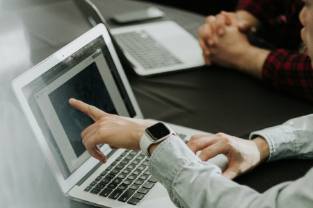 Finance professional reviewing accounting records on tablet