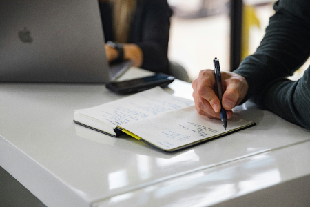 Professional completing payroll documentation