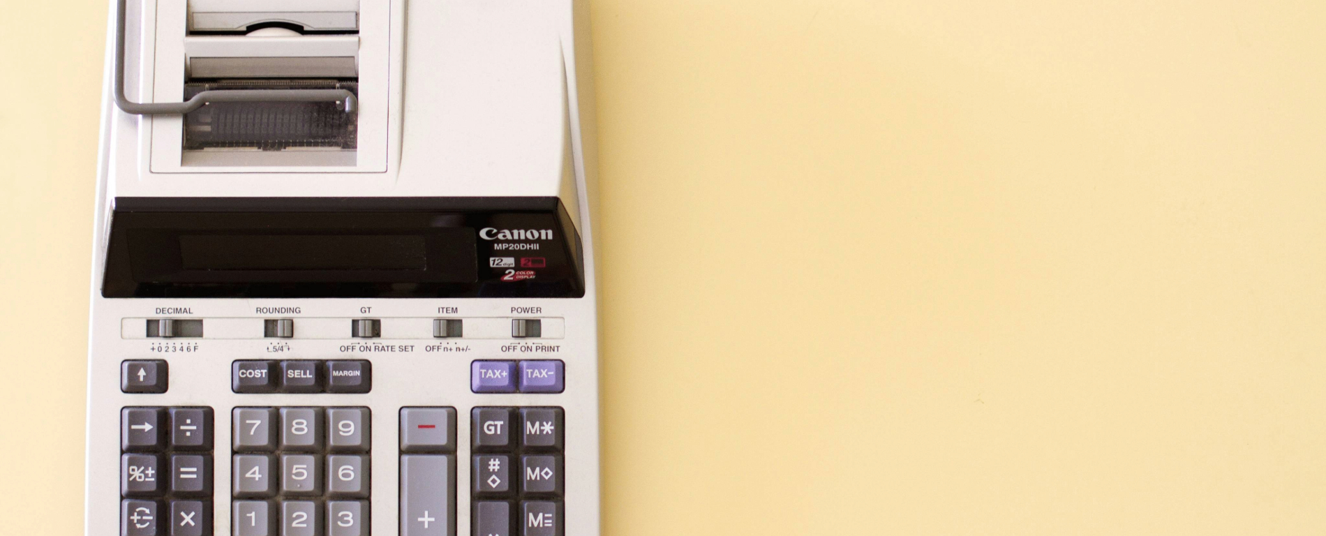canon calculator on a yellow background