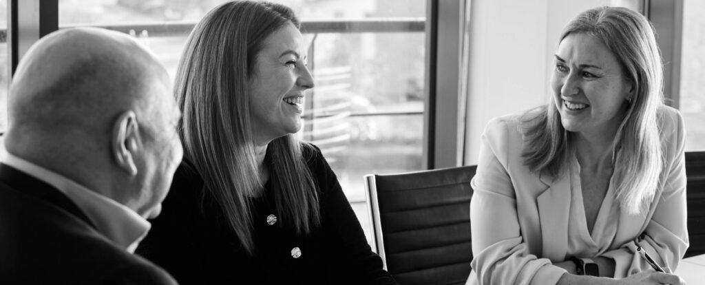 colleagues sat around a talking talking