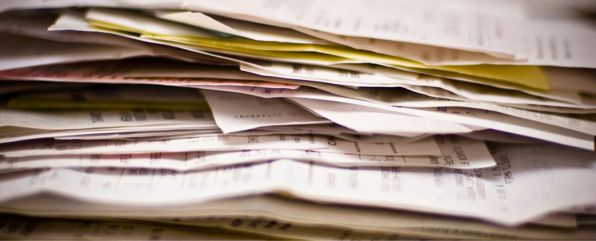 a close up of a pile of receipts